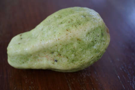 close up wild guava fruit on the wood board backgroundの写真素材