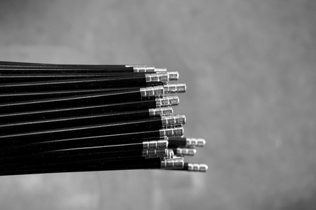close up stack of round stainless tube in factory