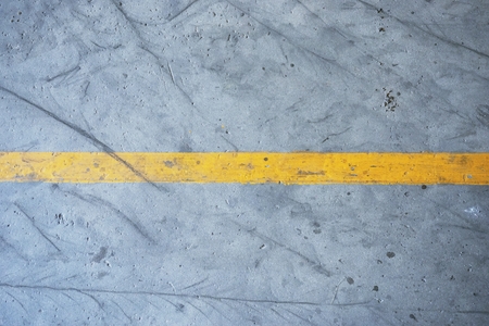 abstract of yellow strip line on concrete floorの写真素材