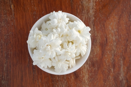 group of white jasmine flower in the cup