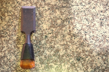 close up old chisel tool used in factory