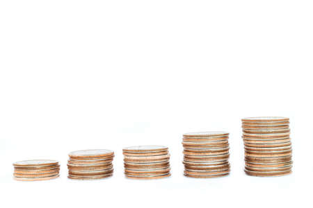 Coin piles on white background. Business and finance concept.