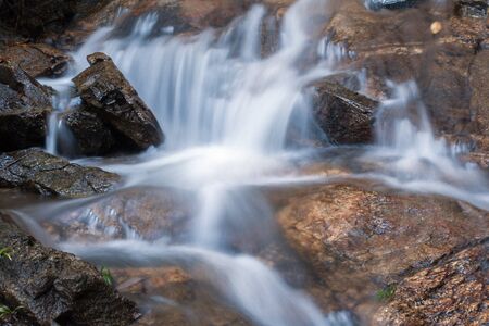 A waterfall in Chiangmai, Thailand.の写真素材