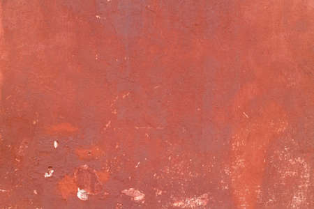Crack red painted wall texture background.の写真素材