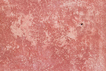 Crack red painted wall texture background.の写真素材