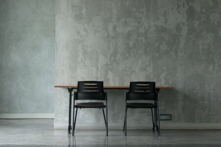 A minimal office in concrete finishing room.