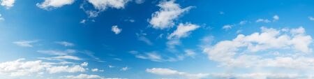 Vibrant color panoramic sky with cloud on a sunny day. Beautiful cirrus cloud. Panorama high resolution photograph.の写真素材