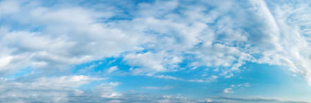 Vibrant color panoramic sky with cloud on a sunny day. Beautiful cirrus cloud. Panorama high resolution photograph.の写真素材