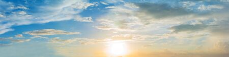 Vibrant color of sun set sky with cloud, panoramic image.の写真素材