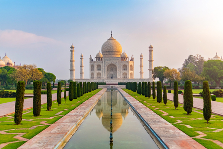 Taj Mahal front view reflected on the reflection pool, an ivory-white marble mausoleum on the south bank of the Yamuna river in Agra, Uttar Pradesh, India. One of the seven wonders of the world.の写真素材