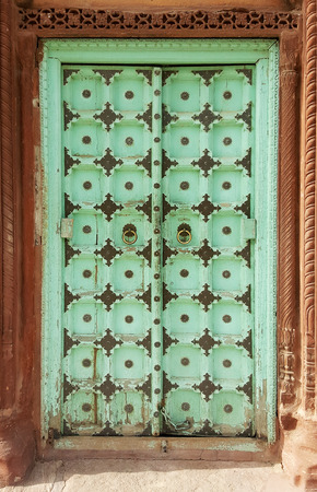 Antique rustic ancient wooden door. Architectural element.の写真素材