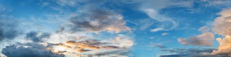 Dramatic vibrant color with beautiful cloud of sunrise and sunset on a cloudy day. Panoramic image.の写真素材