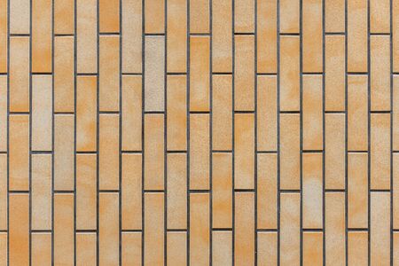 Seamless orange mossaic tiles texture. Architecture material constuction.