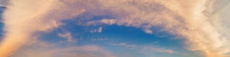 Panorama of Dramatic vibrant color with beautiful cloud of sunrise and sunset. Panoramic image.の写真素材