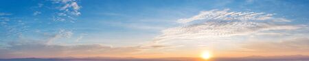 Panorama of Dramatic vibrant color with beautiful cloud of sunrise and sunset. Panoramic image.の写真素材