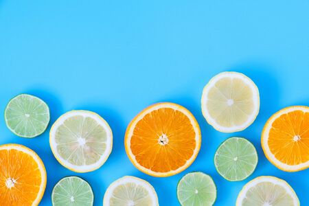Collection of fresh lime, lemon, orange, citrus, grapefruit slice on blue background. の写真素材