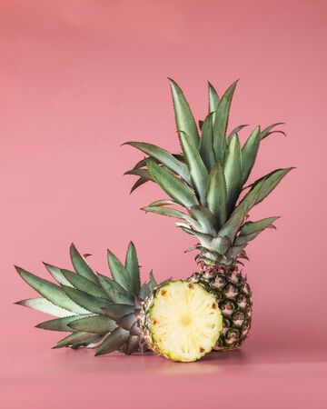 Pineapple fruit isolated on pink background. Healthy lifestyle concept.