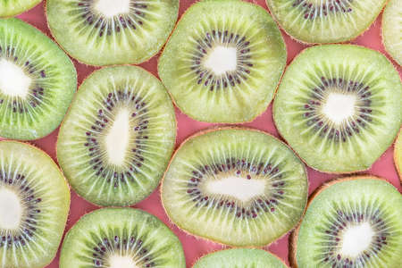Collection of fresh Kiwi slice isolated on pink background.の写真素材