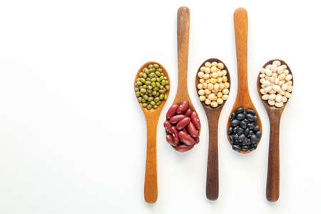 Collection of whole grains seeds isolated on white background. Healthy diet raw ingredients.