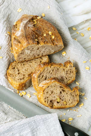 Delicious fresh baked bread on rustic background. Healthy diet lifestyle.