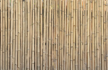 Old bamboo plank fence texture material construction for background.の写真素材