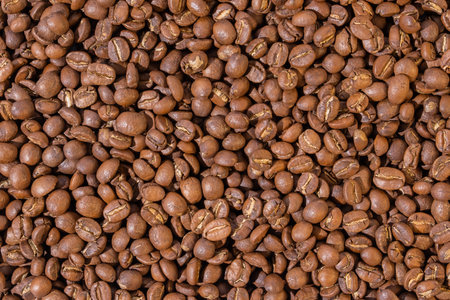 Roasted coffee beans top view wallpaper background.の写真素材
