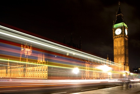 London parliament and big ben by night, with street lightrail の写真素材