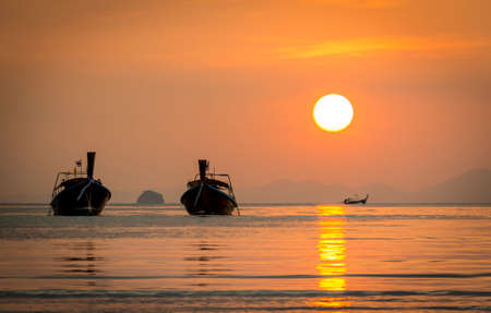 Beautiful sunset in Andaman Sea, Krabi Thailand, with Long tail boats
