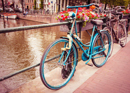 Retro and vintage style bicycle  Locked in Amsterdam, Netherlands  の写真素材
