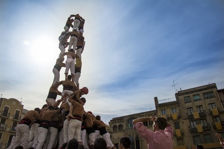 REUS, SPAIN - OCTOBER 10, 2014: Castells Performance, a castell is a human tower built traditionally in festivals within Catalonia. This is also inscribed on the UNESCO Representative List of the Intangible Cultural Heritage of Humanityのeditorial素材