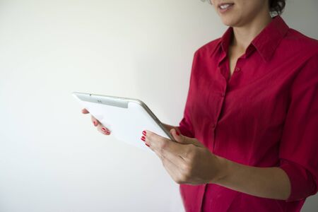 Woman looking at the screen of a tablet. women and technology.の写真素材