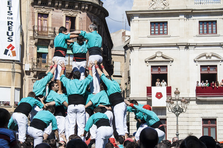 REUS, SPAIN - OCTOBER 07, 2007: Castells Performance, a castell is a human tower built traditionally in festivals within Catalonia. This is alsoon the UNESCO Intangible Cultural Heritage of Humanityのeditorial素材