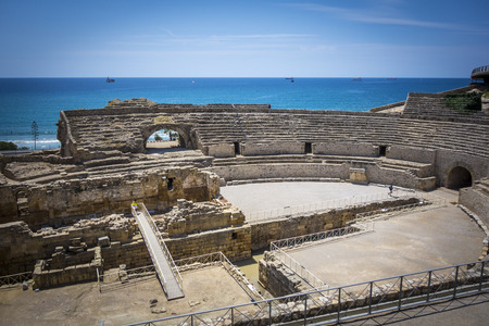 Roman amphitheater and the Mediterranean sea on the background. In Tarragona, Spainの写真素材