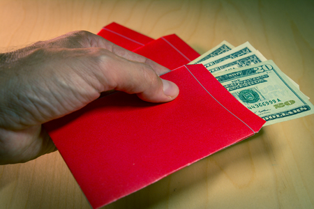The red envelope or hong bao is used for giving money during Chinese New Year in China and Taiwanの写真素材