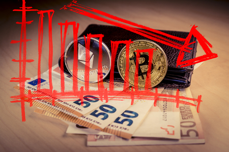 Financial bear market falling concept with physical bitcoin and ethereum over a leather wallet with Euro bills inside and a red down arrow. Bitcoin and other cryptocurrencies ecnomic bubble or speculation conceptの写真素材