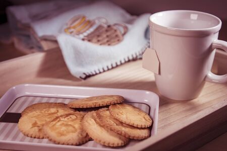 Breakfast scene. White blank mug with cookiesの写真素材