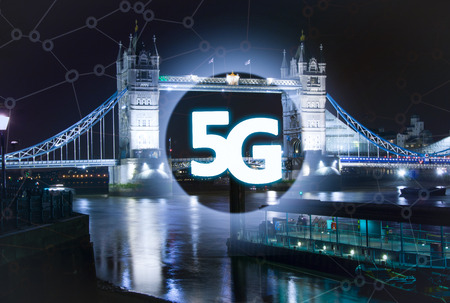 Digital composite of 5G with London tower bridge night lights on the background.5G world summit...