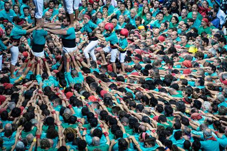 Tarragona, Spain. October 2018: Castells Performance in the XXVII Tarragona Human Tower Competition. A castell is a human tower built traditionally in festivals within Catalonia.のeditorial素材