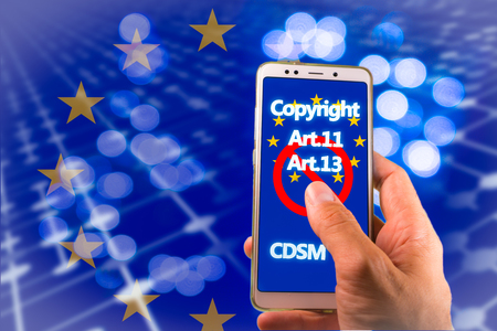 Smartphone with Copyright and EU flag on screen. CDSM metaphor