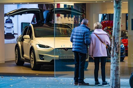 Barcelona, Spain. December 2018: Tesla store near Passeig de Gracia street with model X inside.のeditorial素材