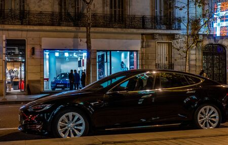 Madrid, Spain. December 2018: Tesla store in Serrano street with model S parked outside.のeditorial素材