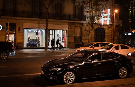 Madrid, Spain. December 2018: Tesla store in Serrano street with model S parked outside.のeditorial素材