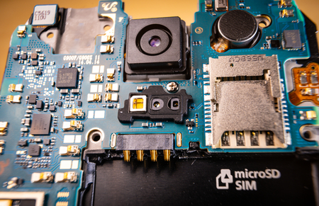 Disassembled mobile phone or smartphone without a back cover, macro shot