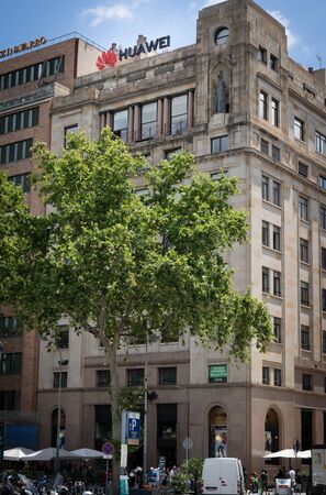 Barcelona, Spain. June 2019: Huawei Technologies Ad sing on a building in Plaza Catalunya.のeditorial素材