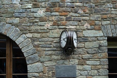 Old retro wall clock at a train station