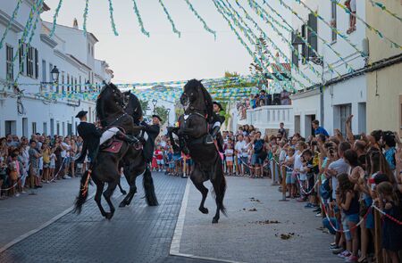 Riders rear up on his horse during a horse celebrations in the Spanish island of Minorcaのeditorial素材