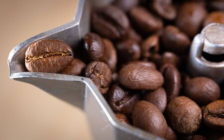 Coffee beans in an italian espresso coffee pot. Morning coffee and relaxing time. Macro shot.の写真素材