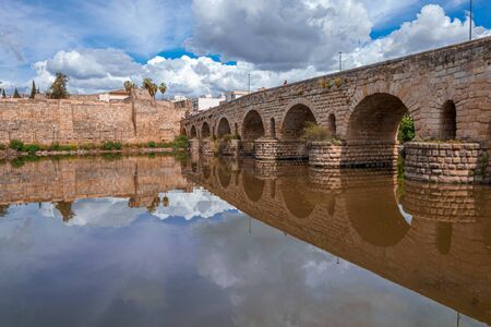 View of the Roman bridge of Merida with its reflection on the Guadiana river. Merida. Spain.The Archaeological Ensemble of Merida is declared a UNESCO World Heritage Site Ref 664の写真素材
