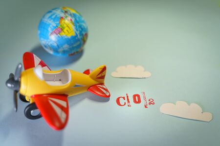 Airplane toy with CO2 word, global warming concept.