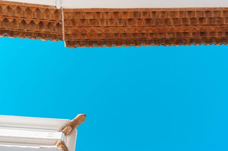 Typical mediterranean houses with white walls against a teal sky. Bottom viewの写真素材